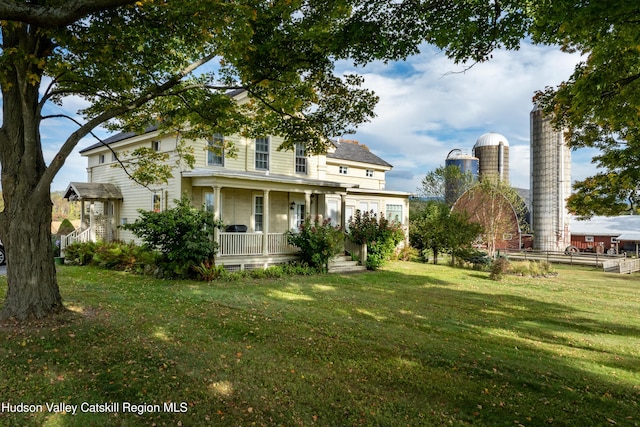 1030 County Route 27a, Ancram, NY 12502 - view of front of house featuring a porch and a front lawn
