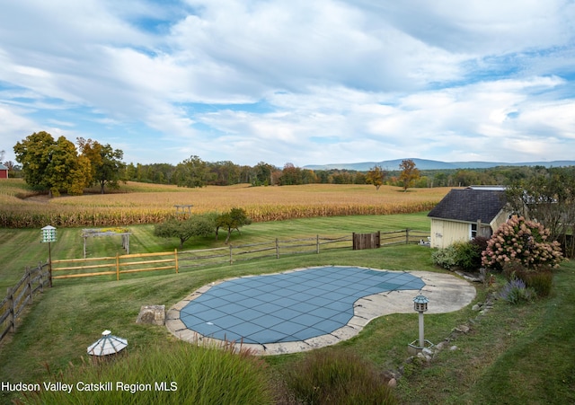 1030 County Route 27a, Ancram, NY 12502 - view of swimming pool with a rural view, an outdoor structure, and a patio area