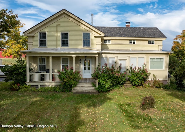1030 County Route 27a, Ancram, NY 12502 - view of front of property with covered porch, a front yard, and a chimney