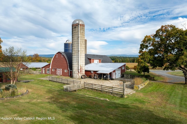 1030 County Route 27a, Ancram, NY 12502 - rear view of house with a barn, a chimney, and an outdoor structure