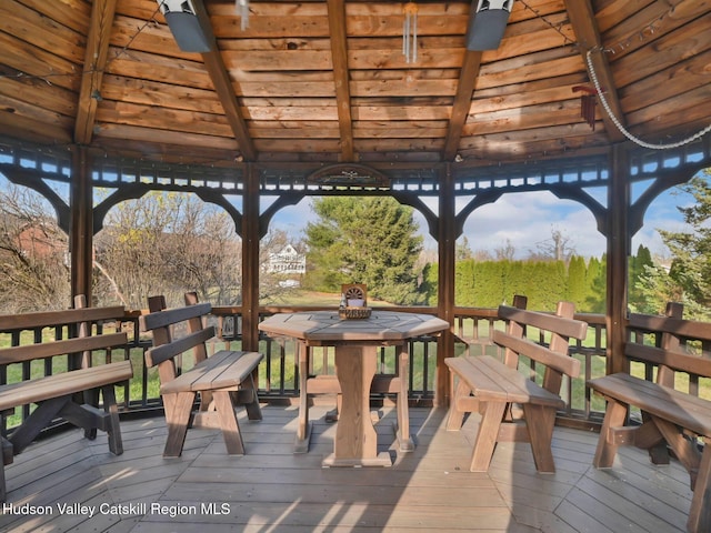 wooden terrace featuring a gazebo