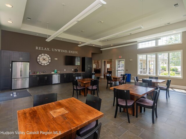 208 Hudson View Ter, Hyde Park, NY 12538 - dining area featuring a towering ceiling, recessed lighting, dark tile patterned flooring, and a tray ceiling