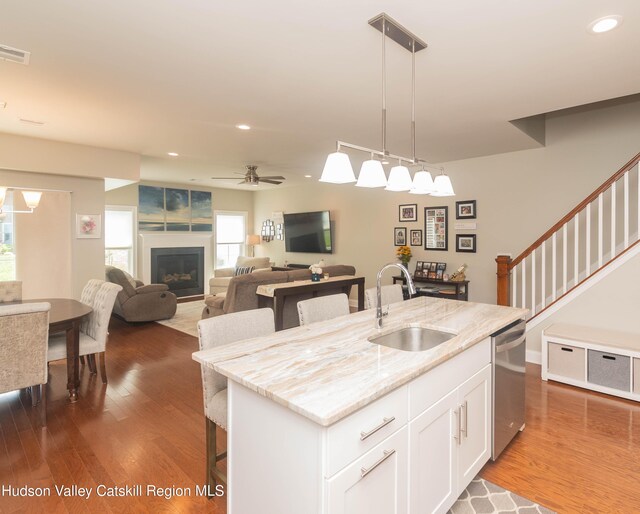 208 Hudson View Ter, Hyde Park, NY 12538 - kitchen featuring dishwasher, a breakfast bar, white cabinetry, pendant lighting, and dark wood-style floors