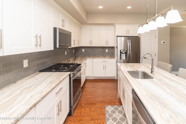 208 Hudson View Ter, Hyde Park, NY 12538 - kitchen featuring stainless steel appliances, recessed lighting, white cabinetry, wood finished floors, and light stone counters