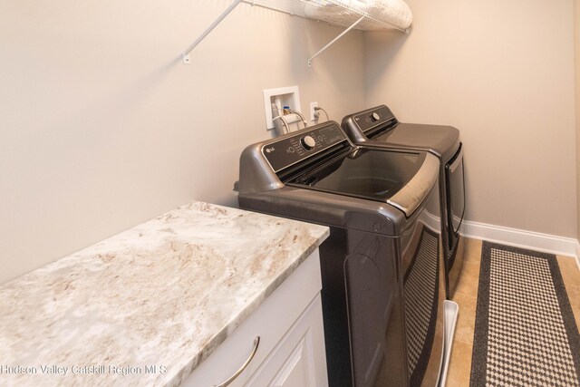 208 Hudson View Ter, Hyde Park, NY 12538 - laundry area featuring washing machine and clothes dryer, cabinet space, and tile patterned flooring