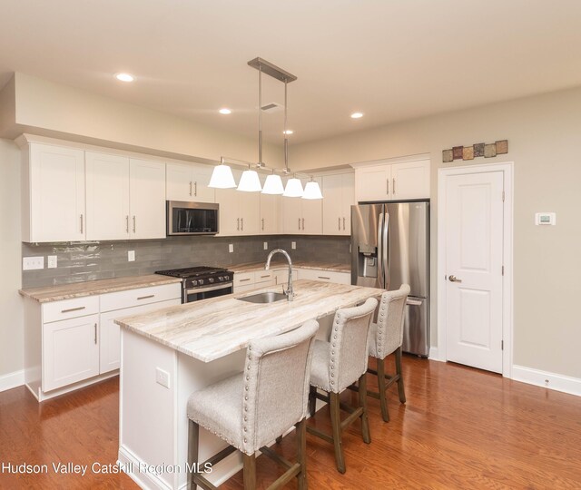 208 Hudson View Ter, Hyde Park, NY 12538 - kitchen featuring appliances with stainless steel finishes, white cabinetry, tasteful backsplash, and recessed lighting