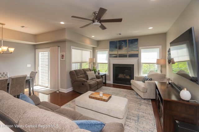 208 Hudson View Ter, Hyde Park, NY 12538 - living area with wood finished floors, a chandelier, a glass covered fireplace, recessed lighting, and ceiling fan