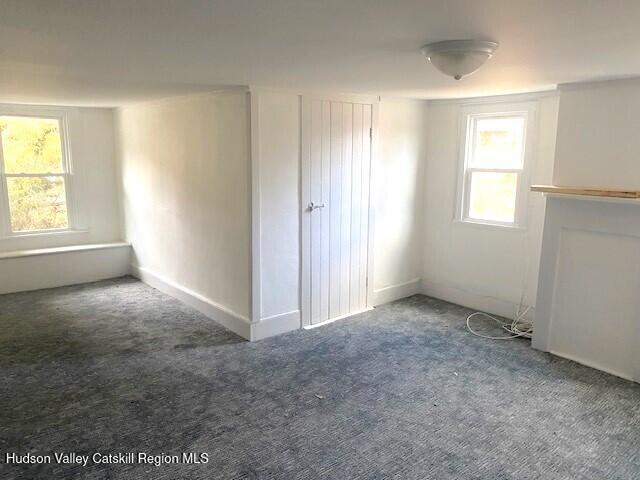 entryway featuring radiator heating unit and wood-type flooring