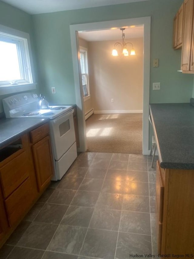 kitchen featuring carpet, decorative light fixtures, a baseboard radiator, a notable chandelier, and range