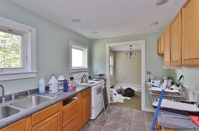 kitchen featuring sink, an inviting chandelier, decorative light fixtures, and white electric range