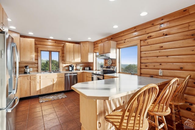 187 Mt Jeffereson Rd, Jefferson, NY 12167 - kitchen featuring stainless steel appliances, log walls, light brown cabinets, a peninsula, and under cabinet range hood