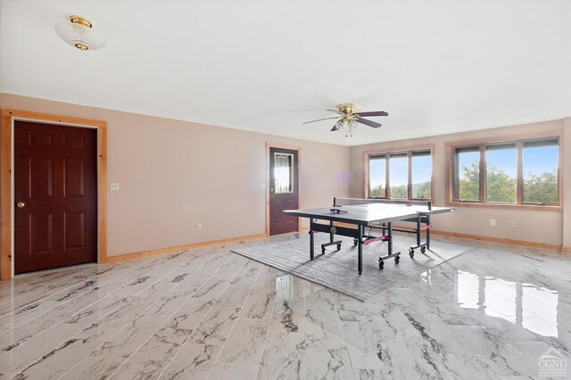 187 Mt Jeffereson Rd, Jefferson, NY 12167 - recreation room featuring healthy amount of natural light, a ceiling fan, baseboards, and light marble finish flooring