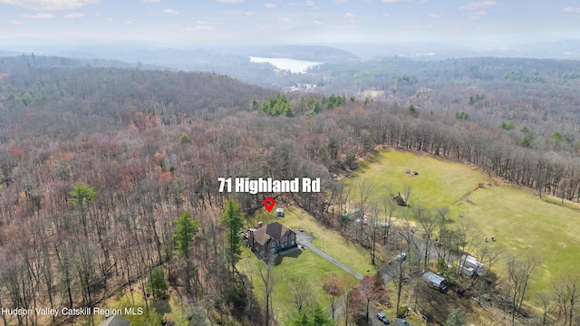 aerial view featuring a forest view