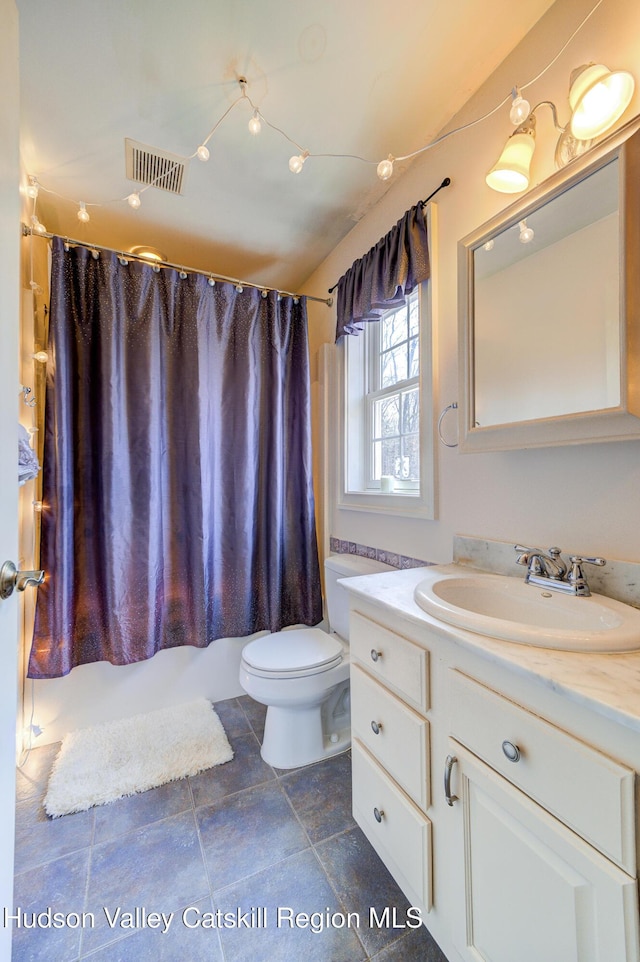 bathroom with toilet, vanity, shower / bath combination with curtain, and visible vents