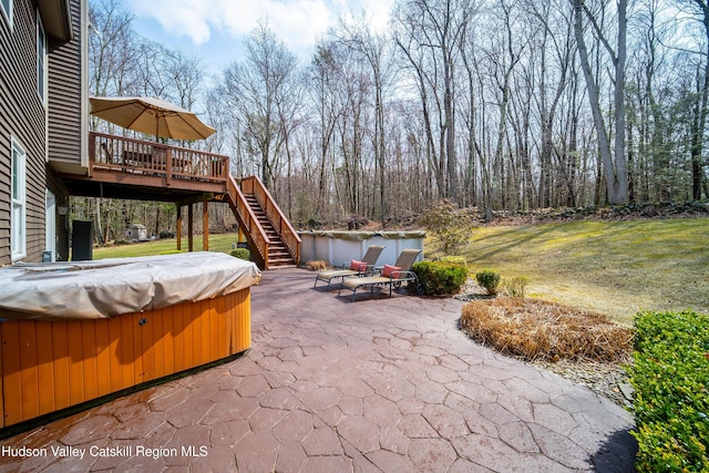 view of patio with stairway, a deck, and a hot tub