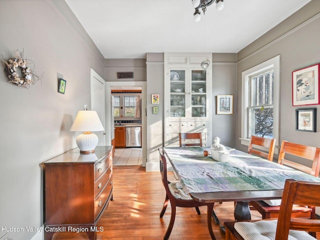 dining space featuring light hardwood / wood-style floors and sink