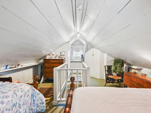 bedroom featuring vaulted ceiling