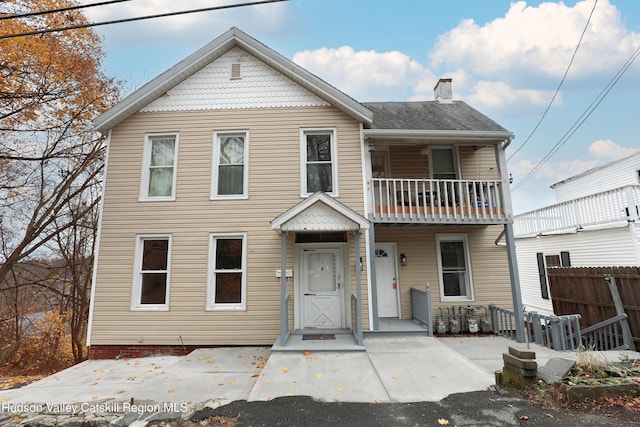 view of front of property with a balcony