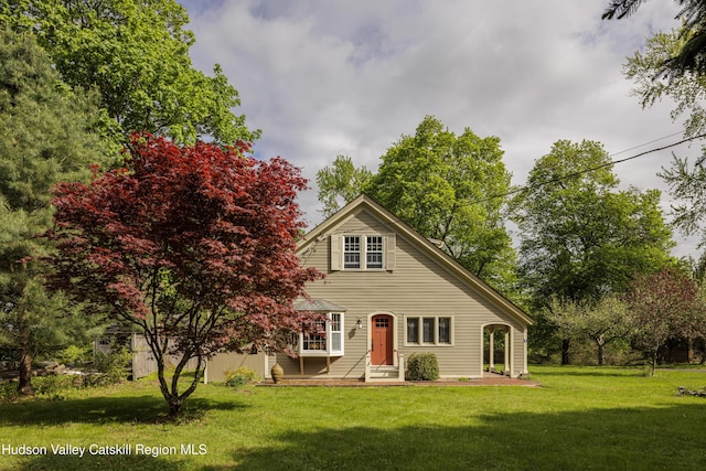 traditional-style home with a front lawn