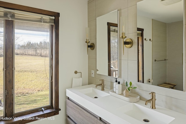 bathroom featuring vanity and decorative backsplash