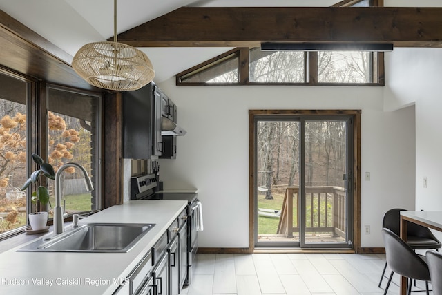 kitchen featuring pendant lighting, lofted ceiling with beams, stainless steel electric range oven, and sink