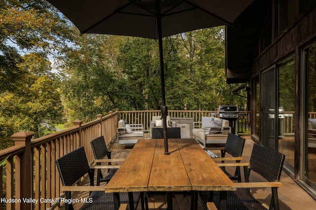 wooden deck featuring an outdoor hangout area and grilling area