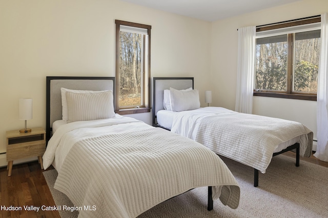 bedroom featuring dark wood-type flooring