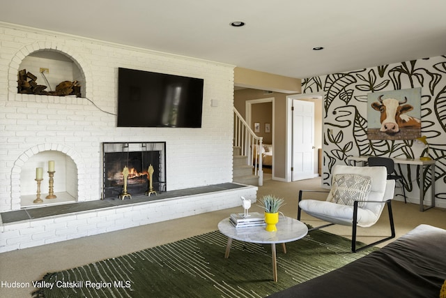 carpeted living room with a fireplace