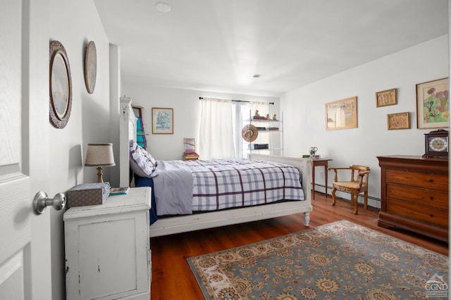 34 Cottonwood Rd, Elizaville, NY 12523 - bedroom featuring a baseboard heating unit and wood finished floors