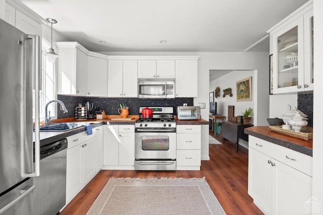 34 Cottonwood Rd, Elizaville, NY 12523 - kitchen with appliances with stainless steel finishes, a sink, backsplash, and dark wood-type flooring