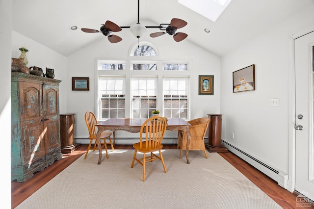 34 Cottonwood Rd, Elizaville, NY 12523 - dining room featuring ceiling fan, a baseboard radiator, baseboard heating, a skylight, and wood finished floors