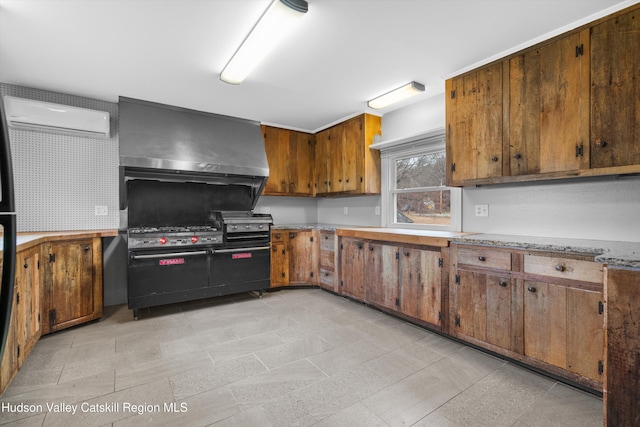 kitchen with wall chimney exhaust hood