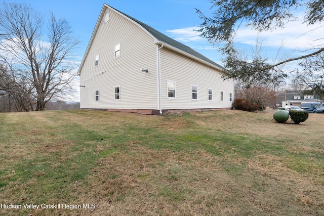 view of property exterior featuring a yard