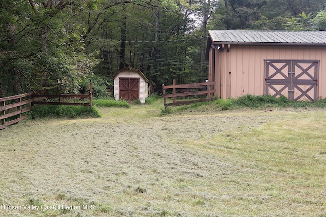 view of shed featuring fence