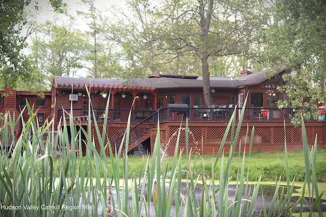 exterior space featuring stairway and a deck