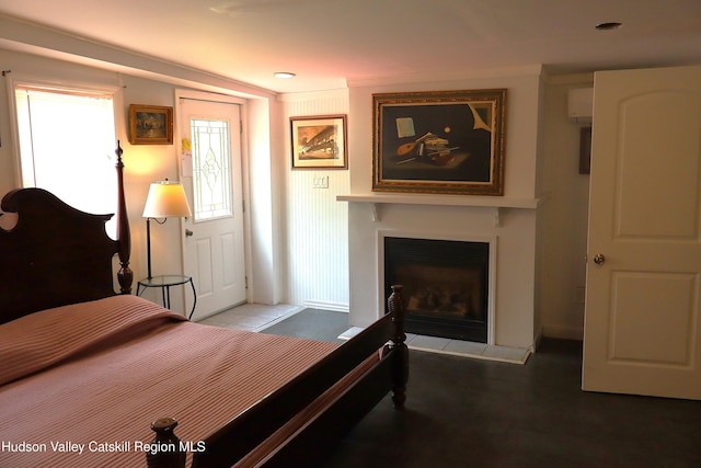 bedroom with a fireplace with raised hearth