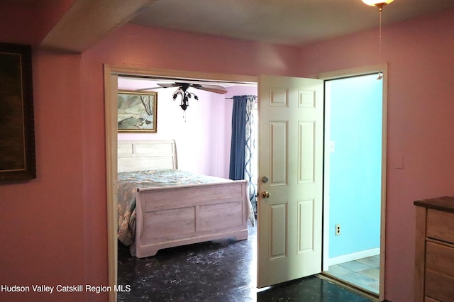 bedroom featuring concrete flooring