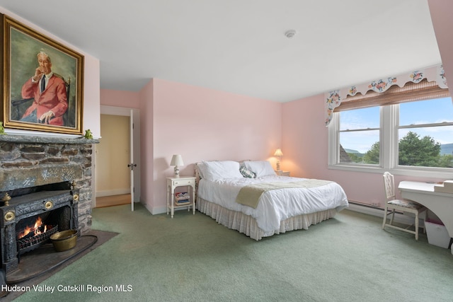 carpeted bedroom featuring a baseboard radiator