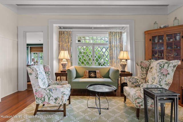 living area with hardwood / wood-style floors and plenty of natural light