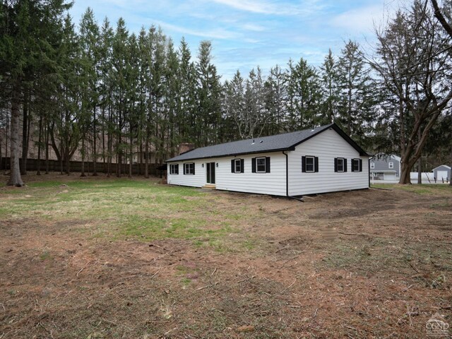 back of property featuring a chimney