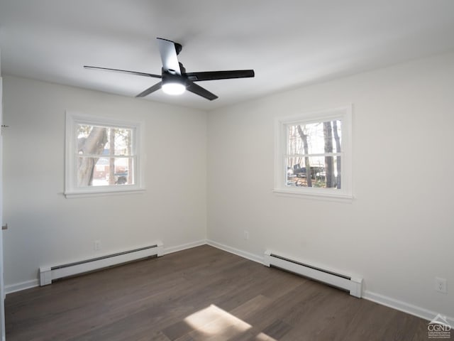 spare room with a baseboard heating unit, ceiling fan, and wood finished floors