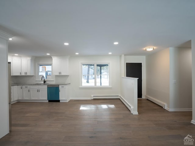 kitchen with baseboard heating, dishwasher, white cabinetry, and recessed lighting