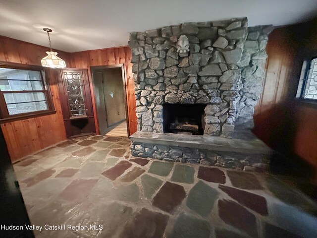 1918 County Route 8, Elizaville, NY 12523 - living room with wood walls, stone flooring, and a stone fireplace