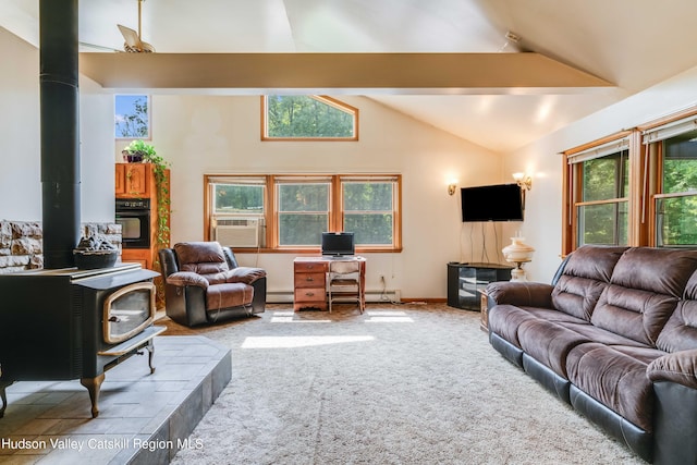 living room with a wood stove, high vaulted ceiling, cooling unit, baseboard heating, and light colored carpet