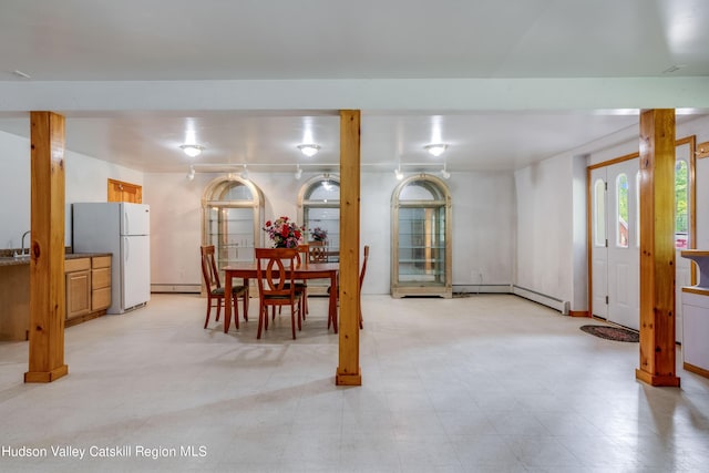 dining area featuring sink and baseboard heating