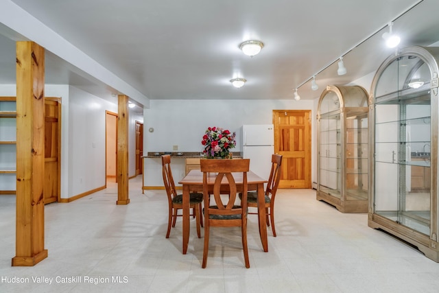 dining room with rail lighting