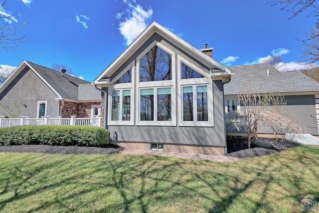 52 Hadley Dr, New Baltimore, NY 12087 - rear view of property with a chimney and a yard