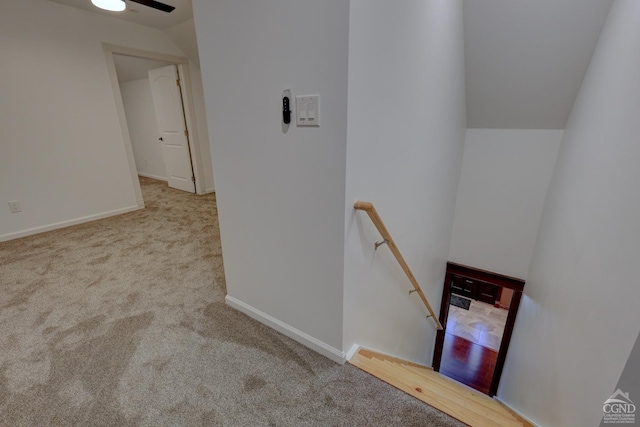 52 Hadley Dr, New Baltimore, NY 12087 - staircase featuring lofted ceiling, carpet floors, and baseboards