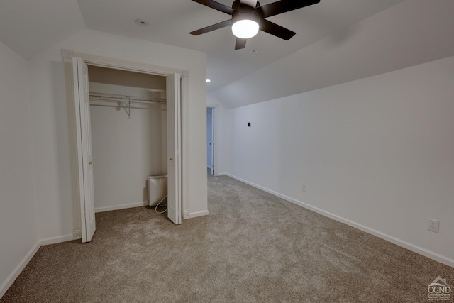 52 Hadley Dr, New Baltimore, NY 12087 - unfurnished bedroom with vaulted ceiling, light carpet, baseboards, a closet, and a ceiling fan