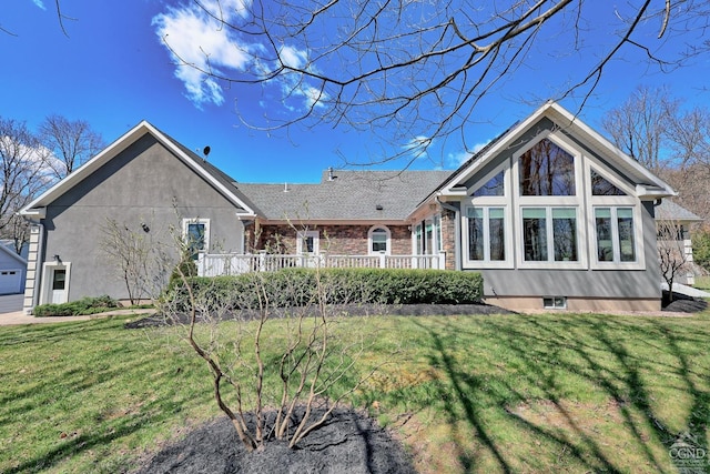 52 Hadley Dr, New Baltimore, NY 12087 - back of property with a yard, stucco siding, and a deck